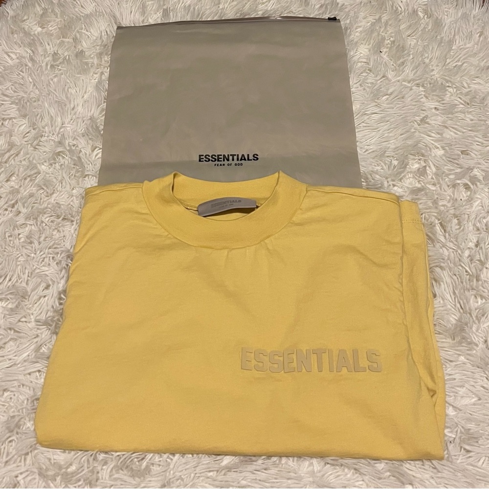 Women’s short sleeved Essentials yellow tee in size medium.